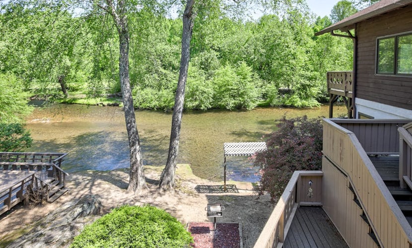 Dog-friendly waterfront condo with furnished patio & fireplace - right in town