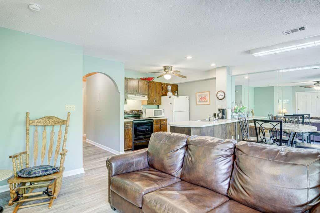 Dog-friendly waterfront condo with furnished patio & fireplace - right in town