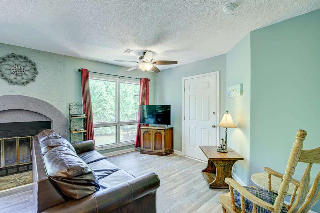 Dog-friendly waterfront condo with furnished patio & fireplace - right in town