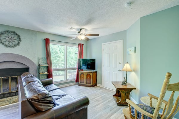 Dog-friendly waterfront condo with furnished patio & fireplace - right in town