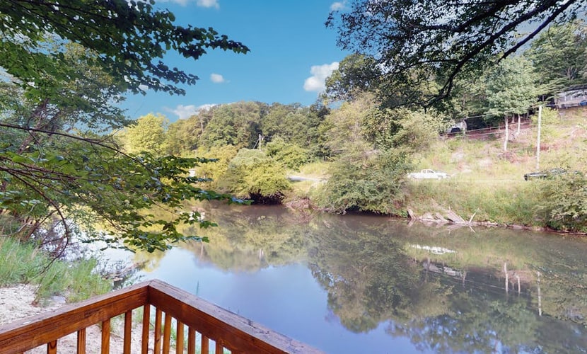 Spacious riverfront home with private dock, firepit & scenic outdoor space
