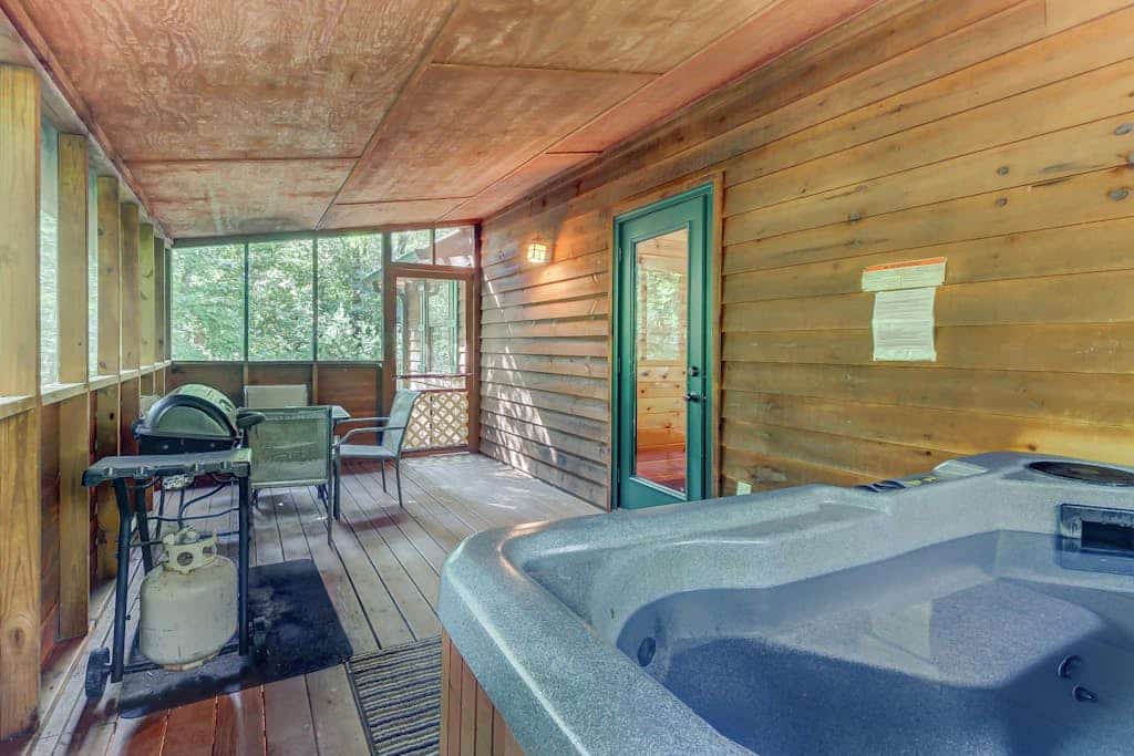 Spacious Dog-Friendly Cabin with Screened Deck, Private Hot Tub, & Firepit