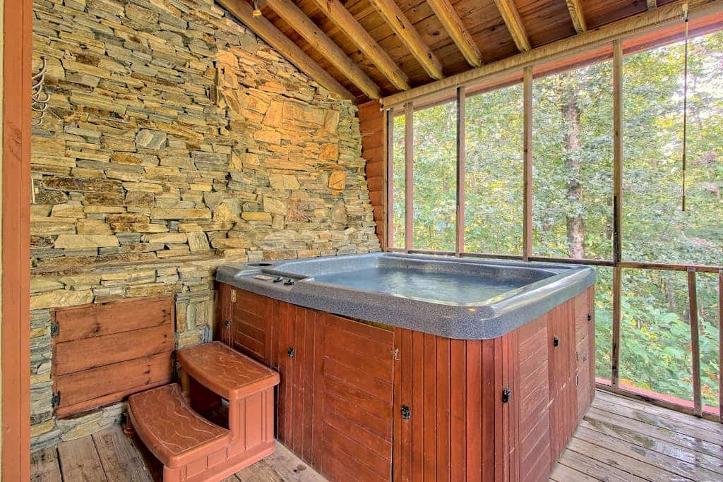 Dog-friendly, two story cabin in woods w/ screened-in deck, hot tub, pool table