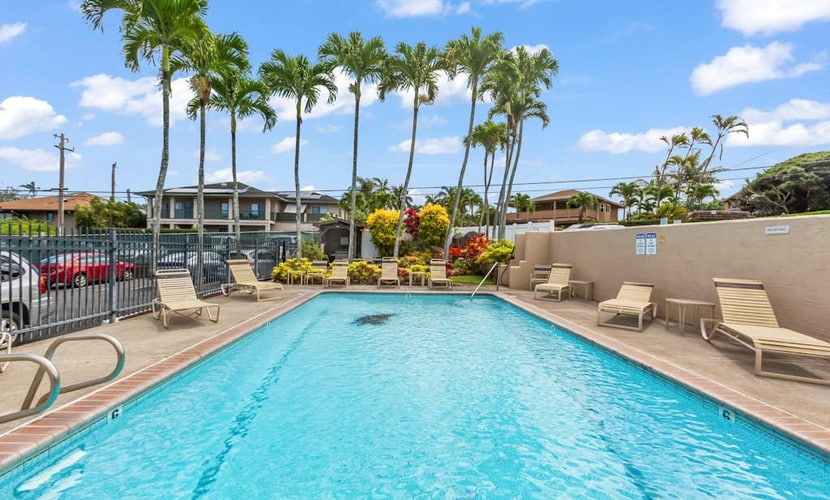 Updated tropical condo with great location, pool access, and central AC