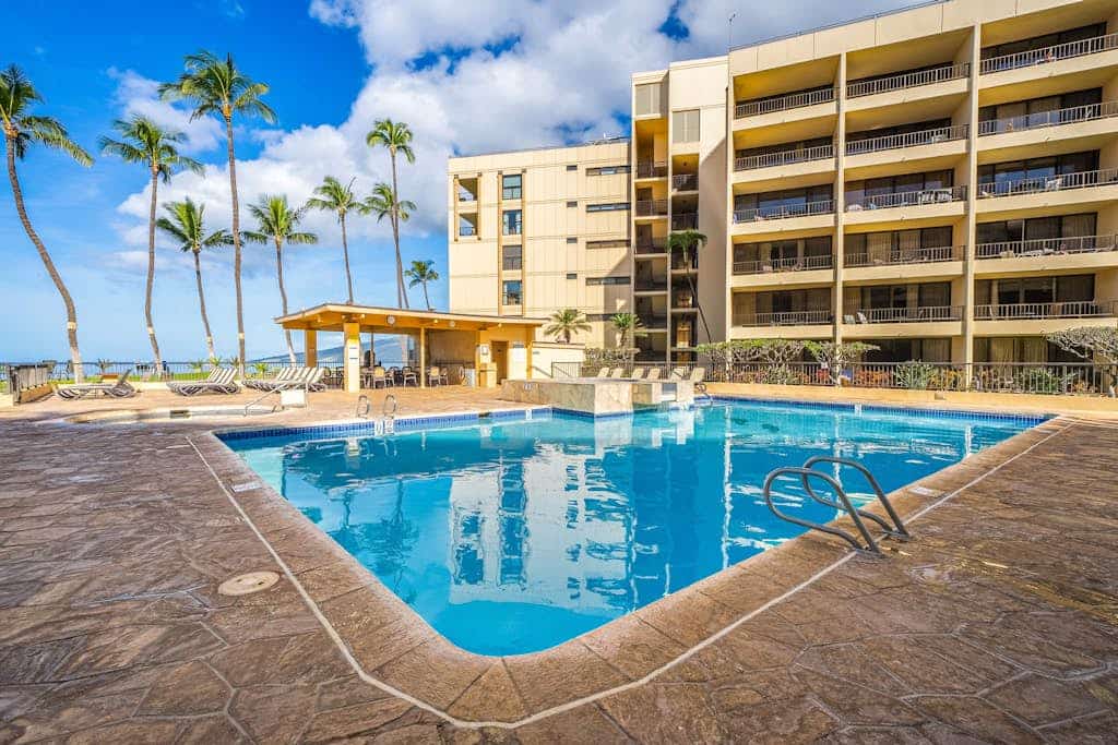 Ocean-view Sugar Beach Resort condo overlooking pool, hot tub & beach access
