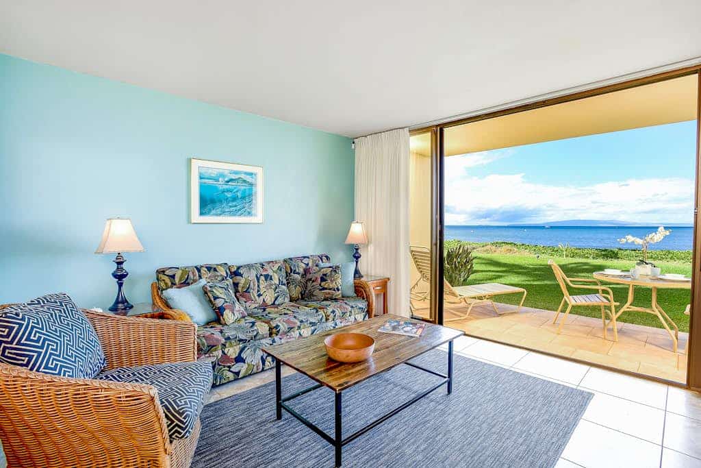 Colorful ground floor condo with A/C, bright interior, steps from the beach and private patio