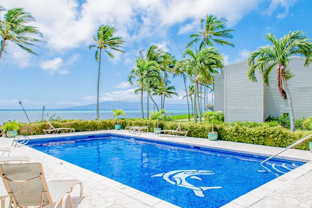 Ocean view condo with shaded lana'i, WiFi & shared pool, tennis, grills, cabana