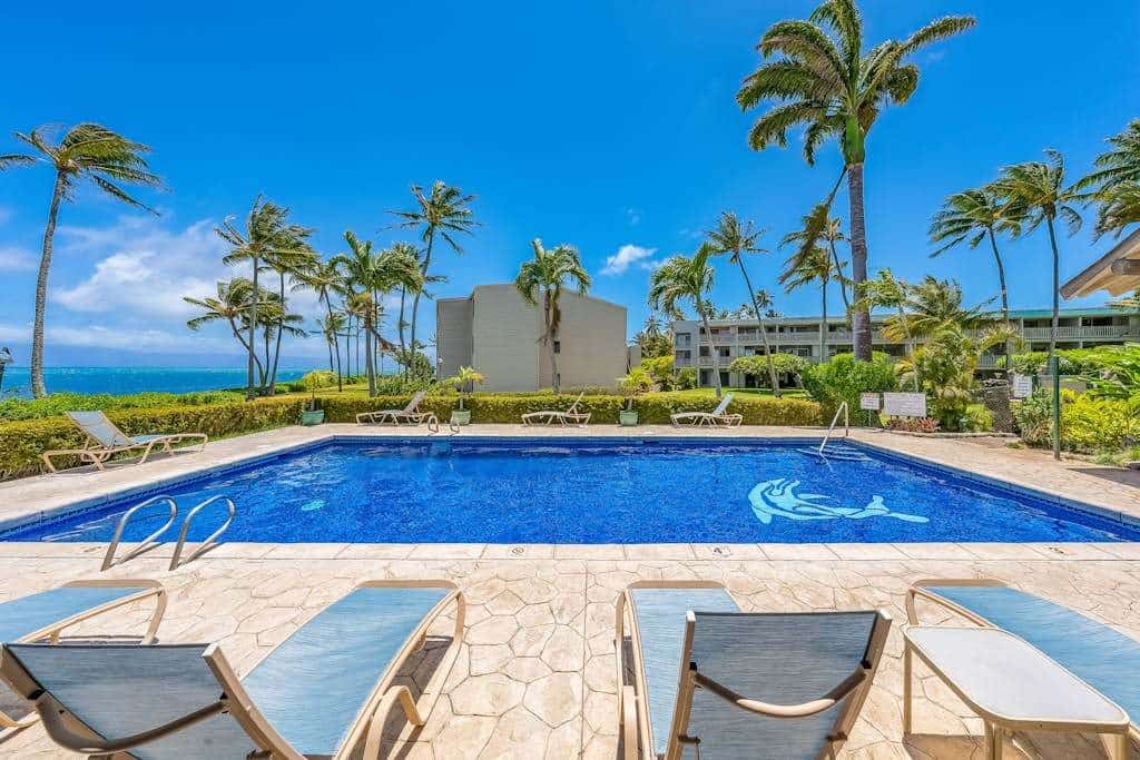 Ocean view condo with shaded lana'i, WiFi & shared pool, tennis, grills, cabana