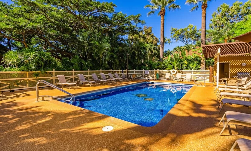 Colorful condo by the beach with a washer/dryer, lanai, & on-site pool