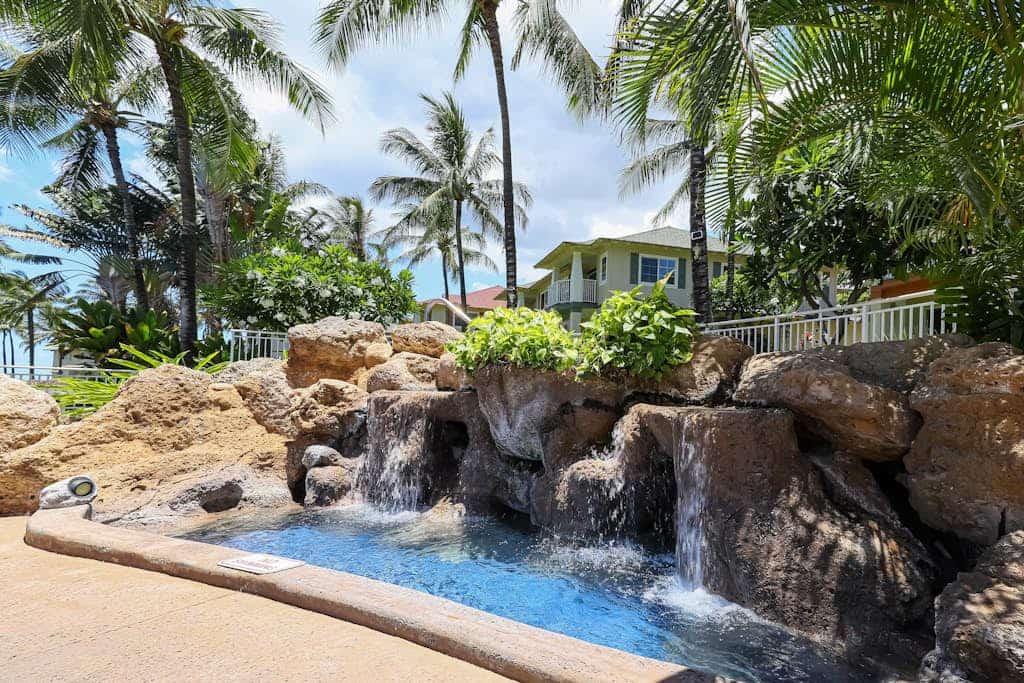 Open concept home with pool, hot tub, & beach access in a gated community