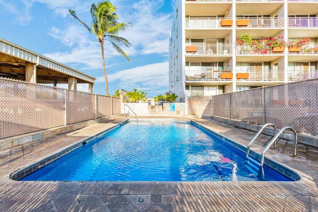 Ocean-view escape with WiFi, lanai, shared pool & grills - walk to the Cove