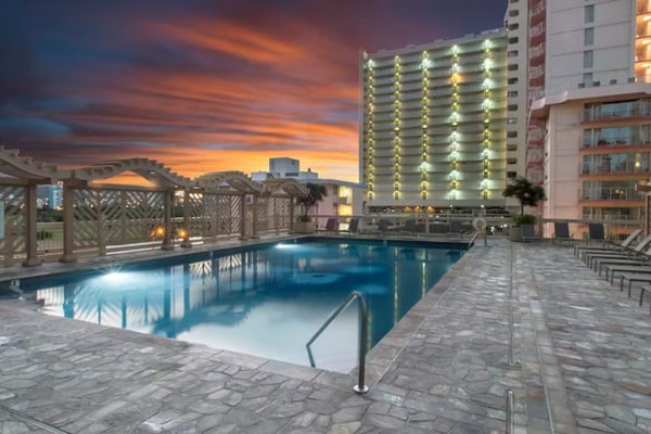 Water-view monthly rental with lanai, rooftop pool & hot tub access