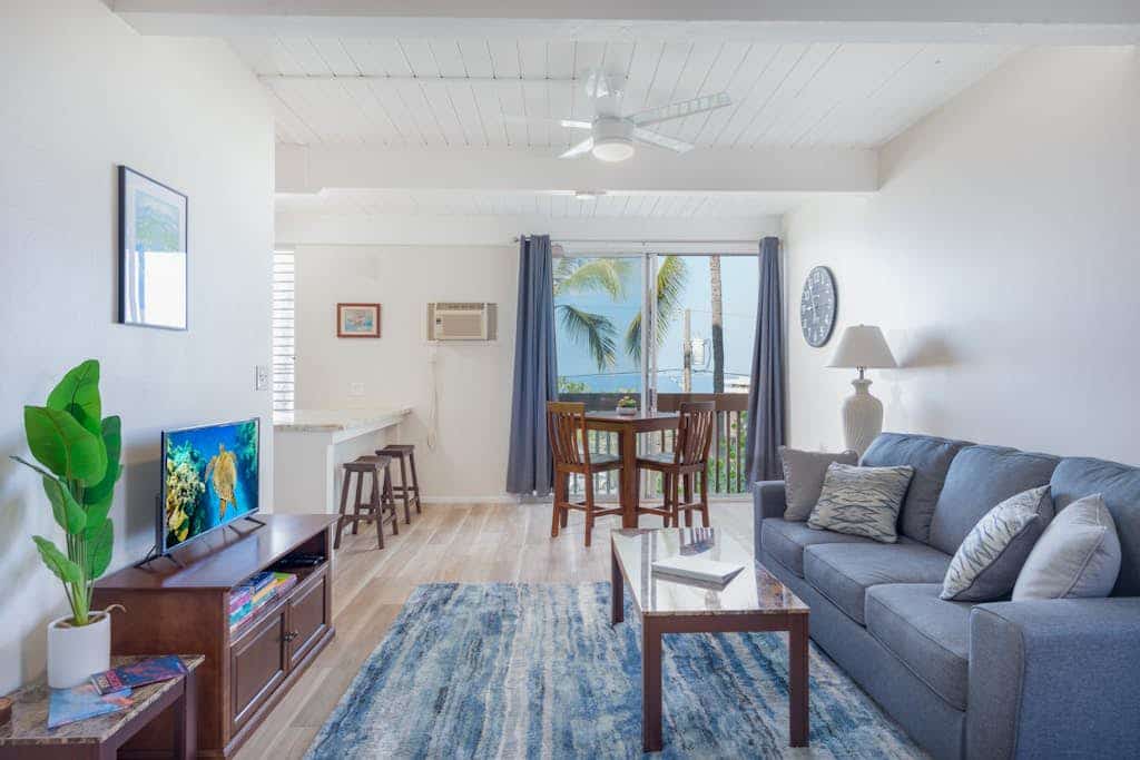 Remodeled second-floor condo with ocean view, pool, & WiFi in a great location