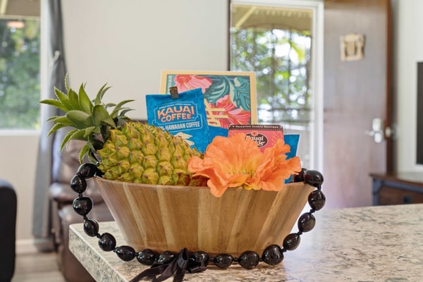 Plan your east-side days around the changeable sky: a misty drive along the Hamakua Coast in the morning, a stop in Hilo for poke or market fruit, then dinner back at your own table. This three-bedroom, two-and-a-half-bath Papaikou home sleeps eight, with seven beds, air conditioning, a kitchen, and laundry for the real work of a family trip. It is a practical base for the part of the Big Island that feels green, rainy, and alive. Spend time at Hawaii Tropical Bioreserve and Garden, take the coastal road through Onomea, or make a day of Hilo's shops and waterfront. The home gives a larger group room to regroup after wet shoes, snacks, and a full day outside. It suits families who want to trade resort bustle for the Hamakua Coast's slower, rain-forest side.