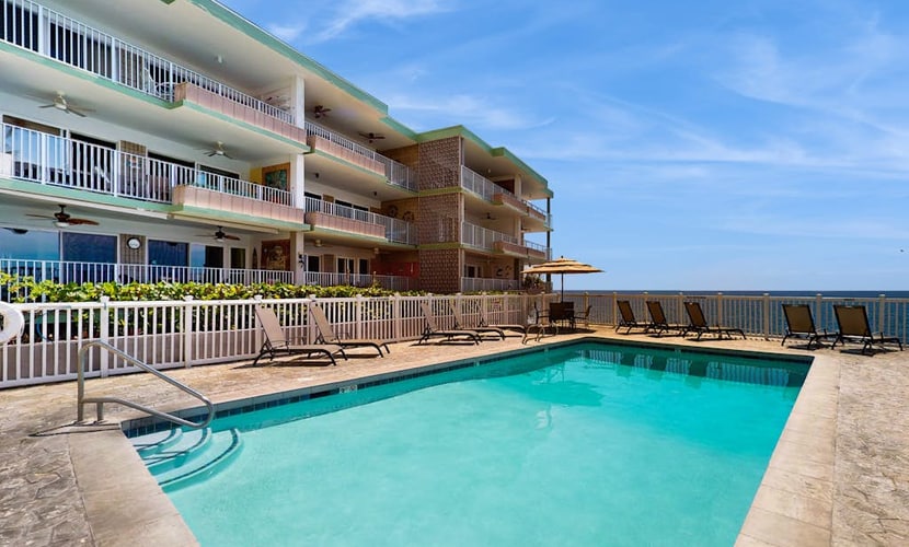 Charming condo with oceanfront pool, shared grill, A/C and beach access nearby