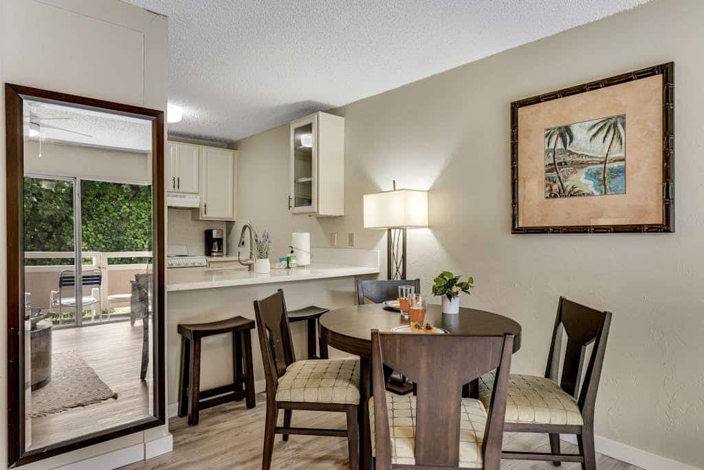 Ground-floor getaway w/ a furnished patio, shared pools, grills, & shuffleboard
