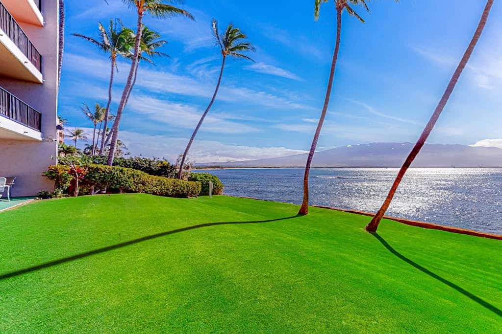Oceanfront condo with lanai, pool, grill, beach gear, smart TV, W/D, partial AC