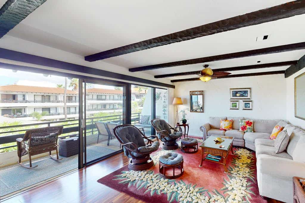 Waterfront condo with shared pools, private beach, lanai, W/D, and AC