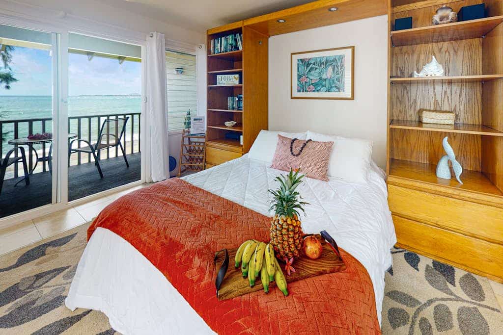 Upper-floor oceanfront studio with balcony, water views & outdoor pool