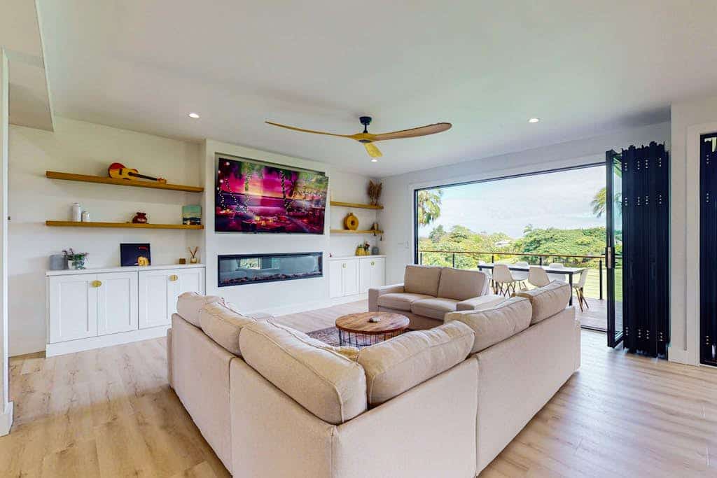 Stunning home with multiple lanais, private gym, lush green space & fruit trees