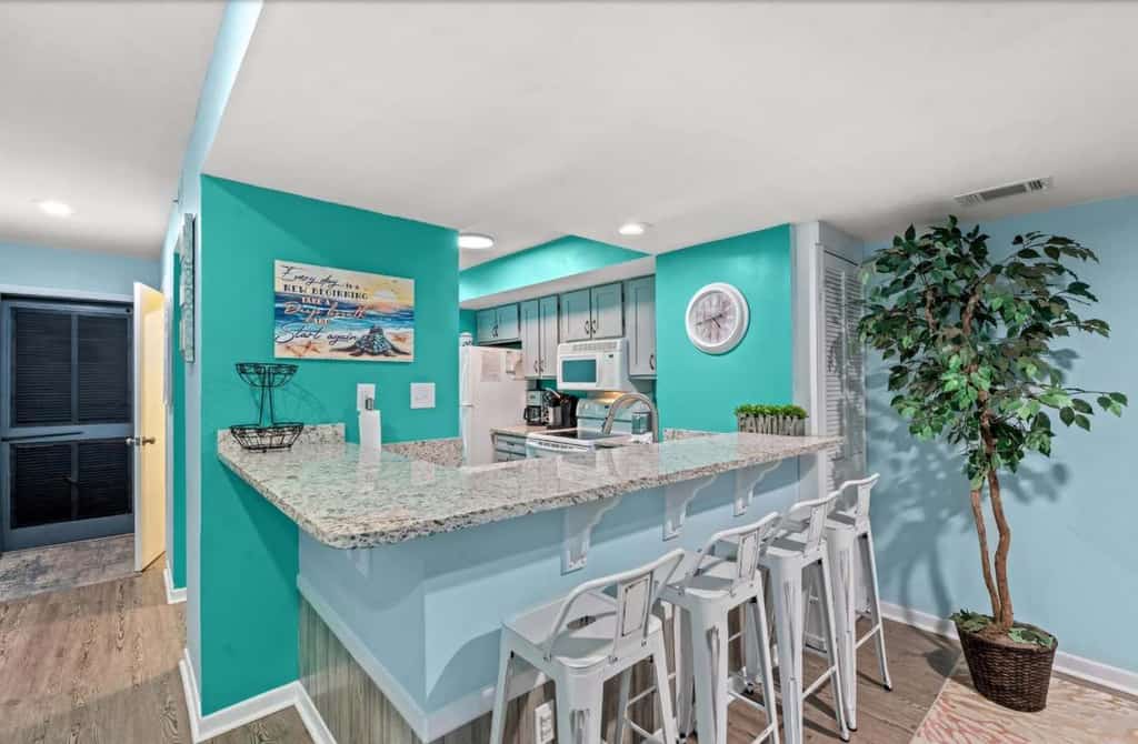 Welcome to Summertree A13, a spacious and inviting 2 bedroom, 2.5 bathroom beach retreat located just a short stroll from the sandy shoreline and nearby fishing pier. Thoughtfully designed for families and groups, this charming coastal getaway comfortably accommodates up to 6 guests with a king sized bed, two full sized beds, a full sleeper sofa, and a twin sleeper sofa. Whether you're planning a relaxing beach vacation or a fun filled family getaway, this condo offers the perfect blend of comfort, convenience, and location.