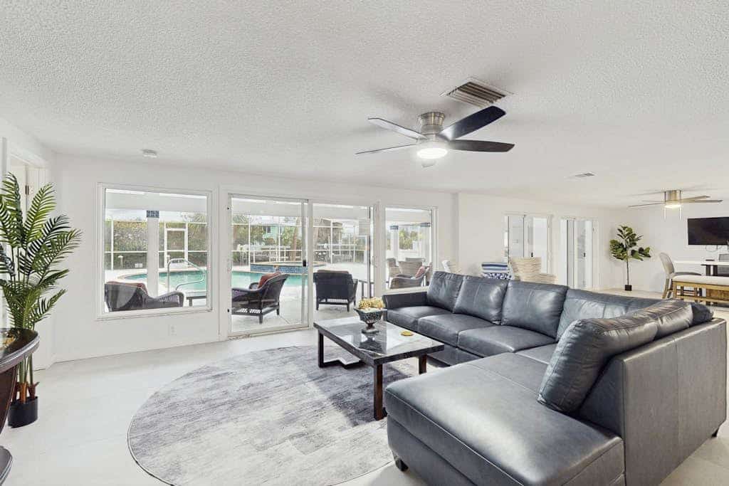 Waterfront dog-friendly home with heated private pool, dock, views, and lanai