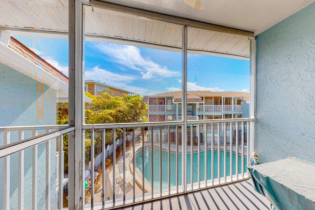Gulf-view condo with pool, grill access, balcony, washer/dryer & central AC