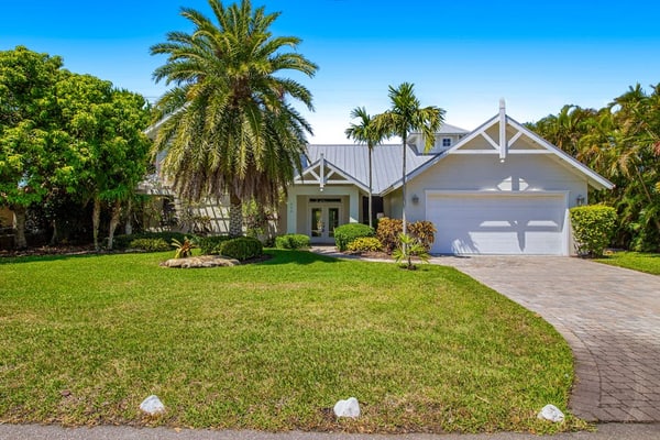 Waterfront home with heated pool + spa, patio, grill, & free WiFi - dog-friendly