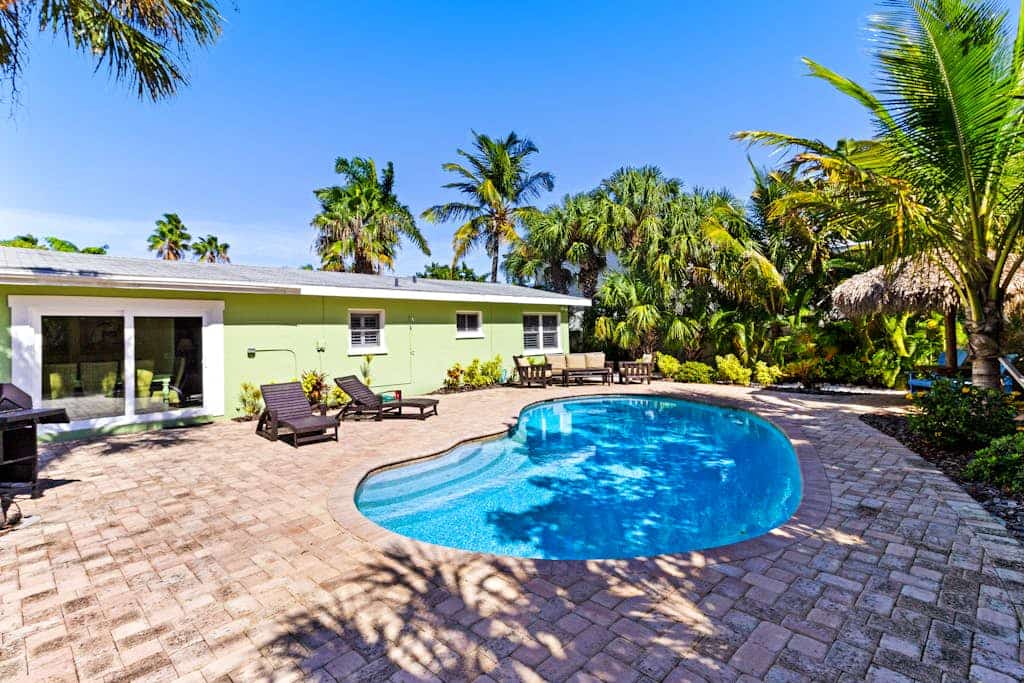 Tropical-themed getaway w/ heated private pool - walk to free trolley, shopping