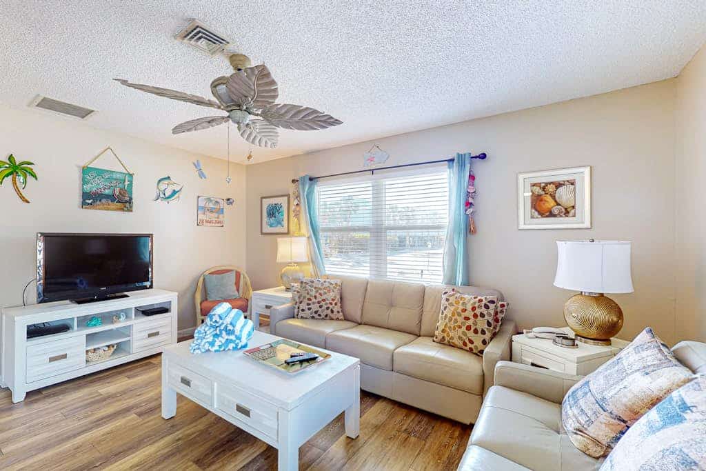 Ground-floor home with fast WiFi, shared pool, & central AC - close to beach