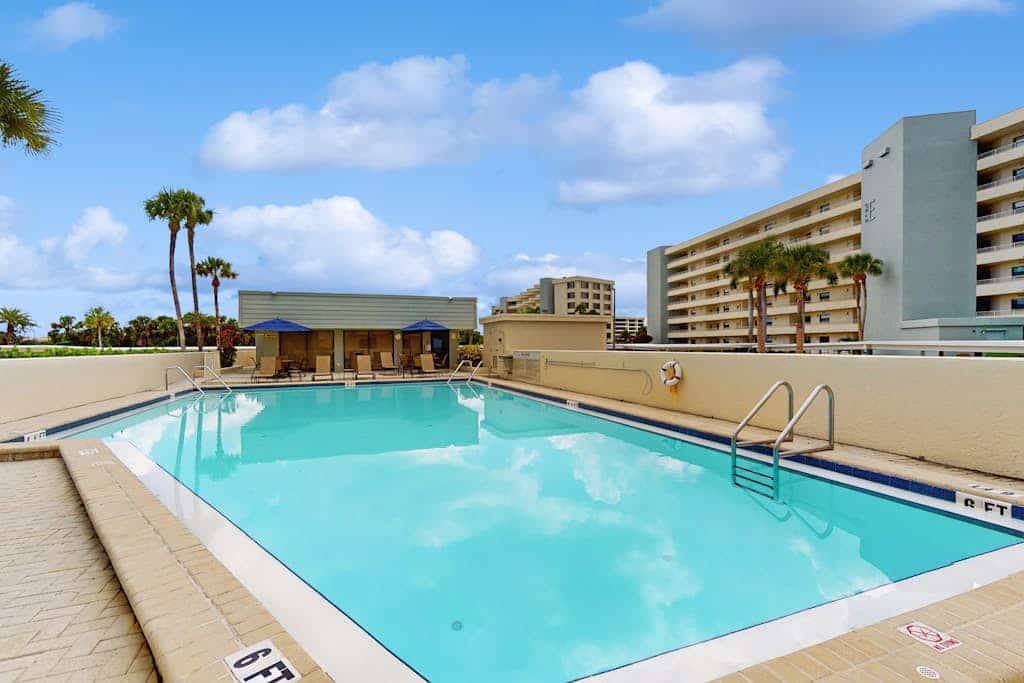 Stunning beachfront condo with panoramic views, pickelball, and dual masters