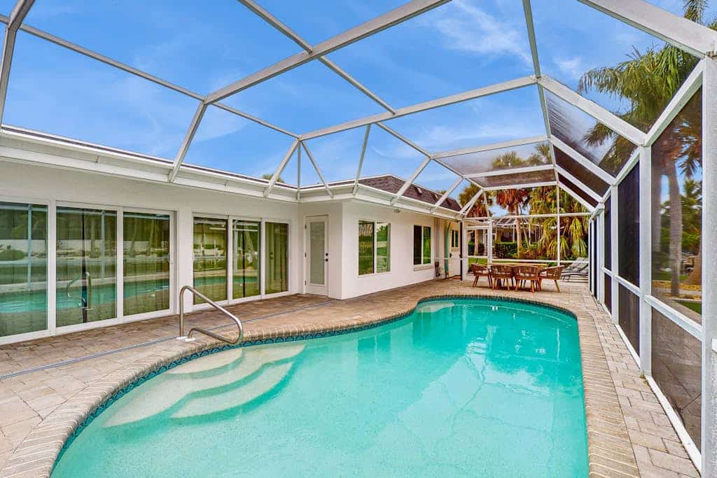 Waterfront retreat with pool ,dock, family friendly, steps to the Gulf, W/D