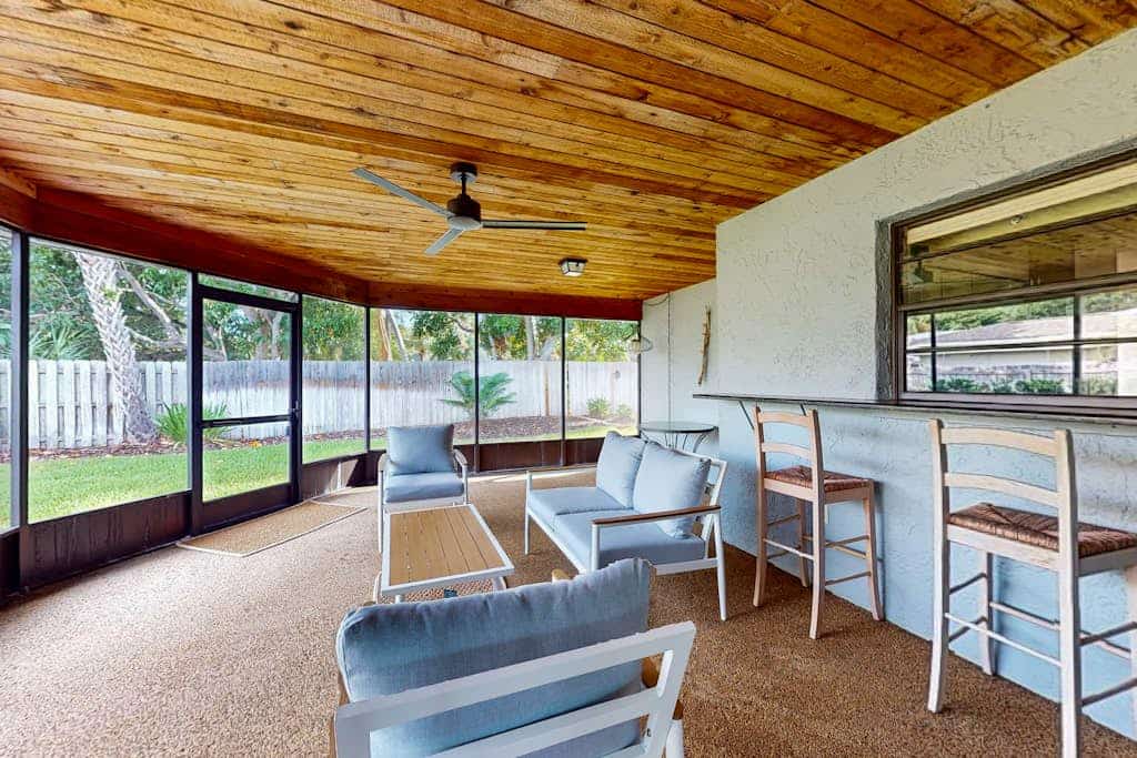 Snowbird-friendly home near beaches with enclosed yard, grill, screened patio