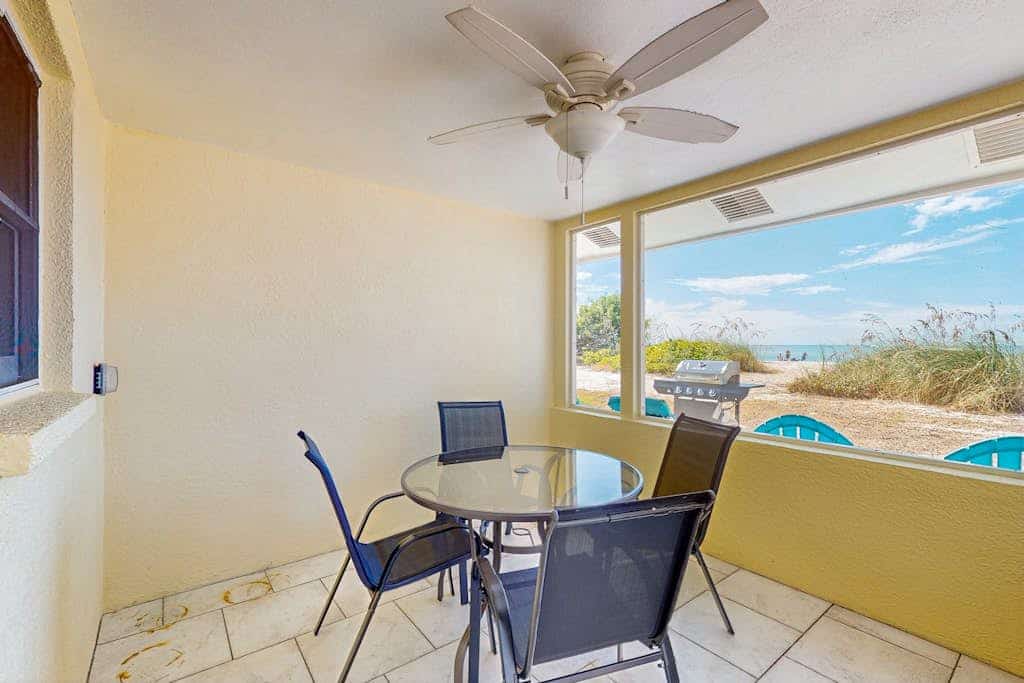 Quaint beachfront duplex in ideal location with screened lanai & free trolley