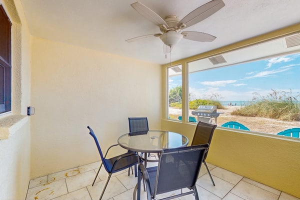 Quaint beachfront duplex in ideal location with screened lanai & free trolley