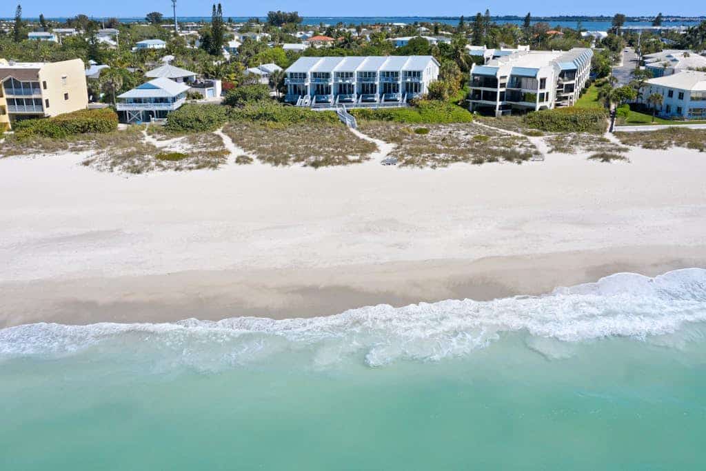 Beachfront condo with WiFi, two decks, Gulf views & pool - walk to the trolley