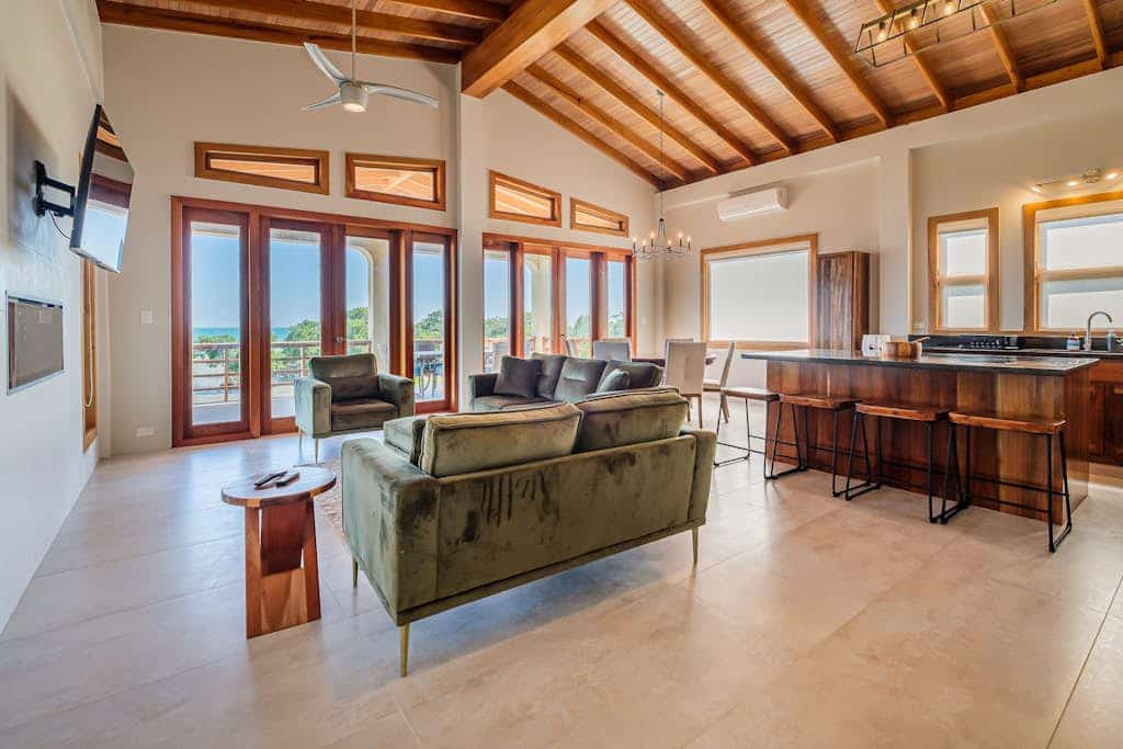 Tropical retreat with a pool, dock, bikes, canoes, balconies, and 360 views