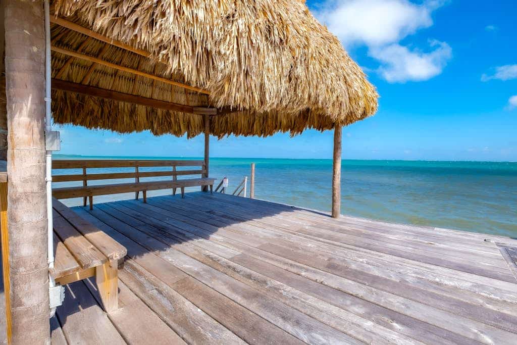 Tropical retreat with a pool, dock, bikes, canoes, balconies, and 360 views