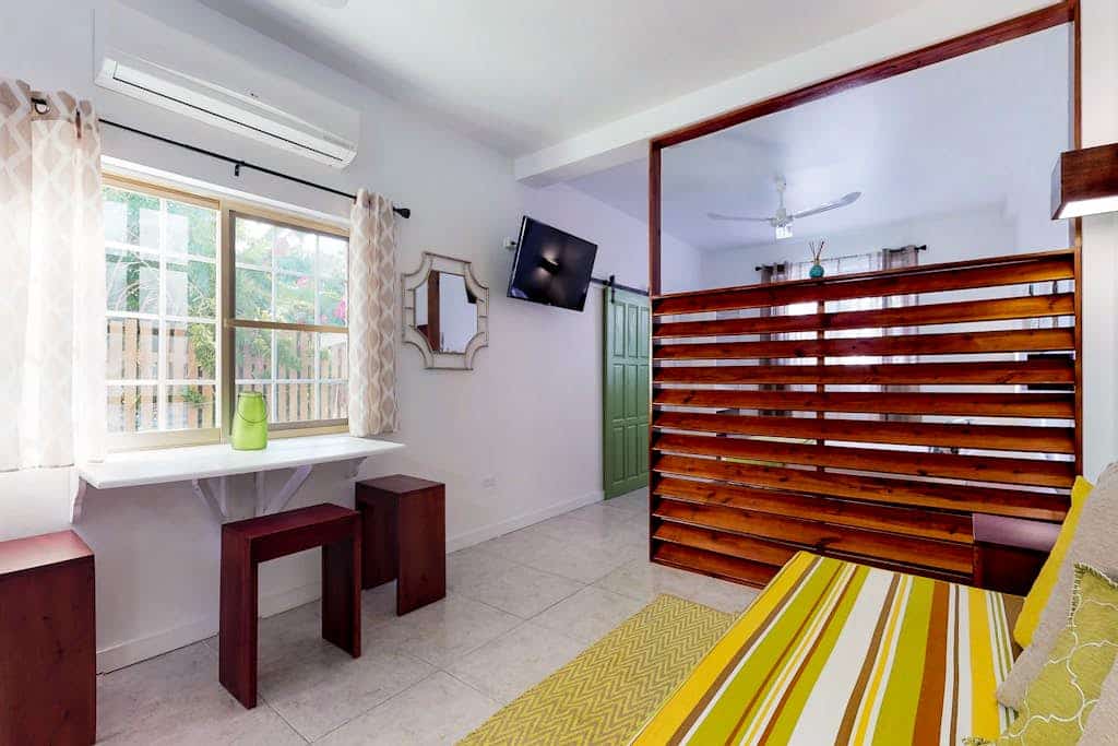 Tropical studio w/patio, WiFi, AC - steps to the sea, water taxis & restaurants