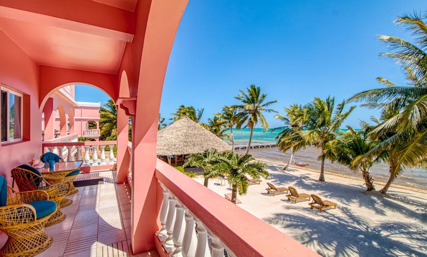 Beachfront condo with beach access, dock, pool, balcony, & ocean views