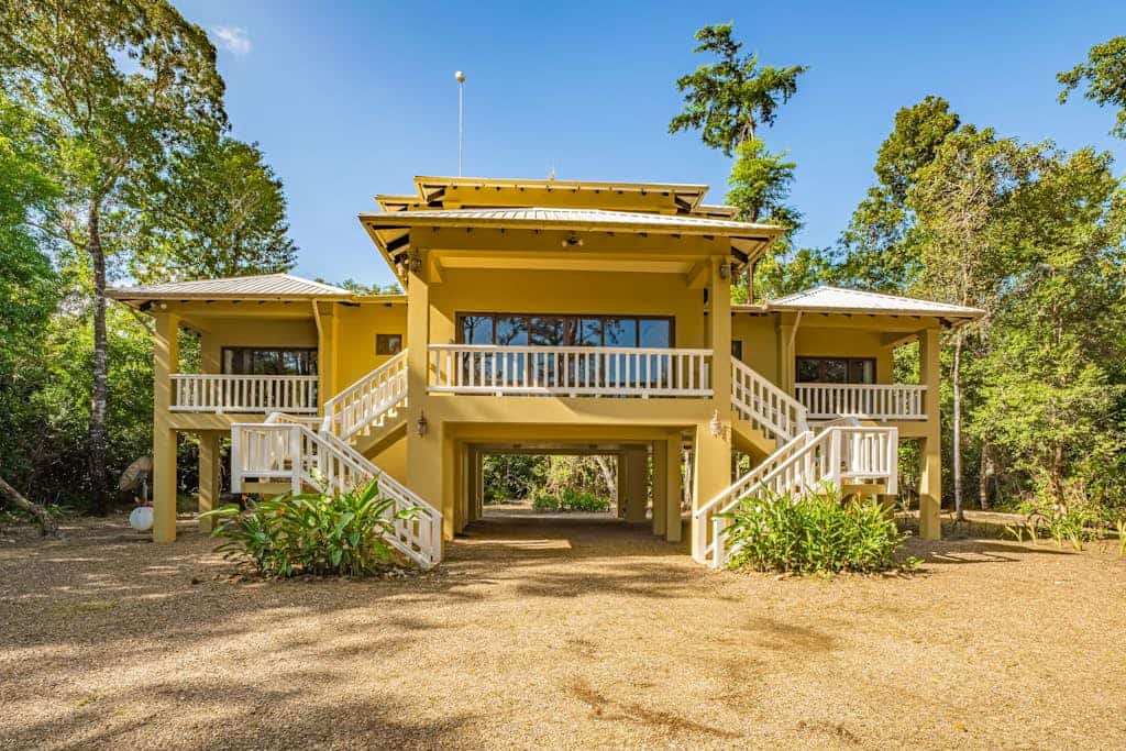 Set within Red Rock, formerly known as The Reserve / Sanctuary Bay, this two-bedroom home offers a quiet tropical setting with access to the community Beach Club and shared pool. With a king bedroom, queen bedroom, full kitchen, WiFi, and space for four, it’s a comfortable base for couples, friends, or small families exploring southern Belize.