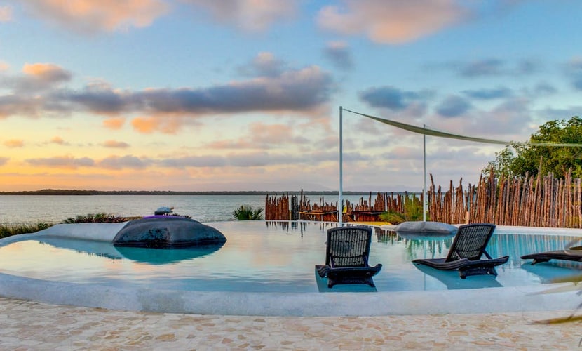 Lagoon-front studio with water access, infinity pool, & AC
