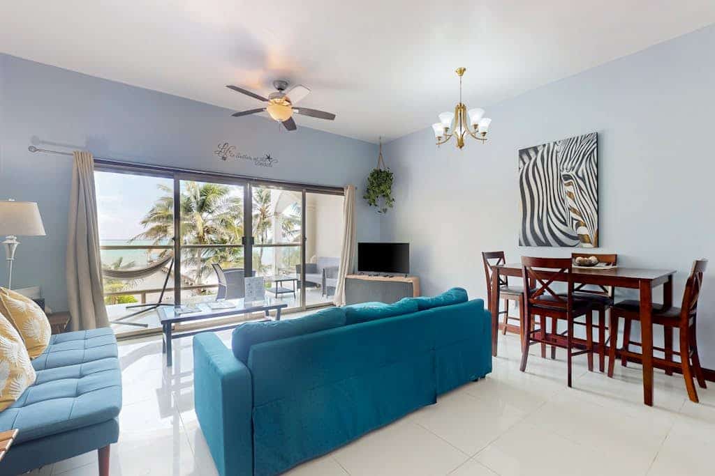 Beachfront condo with balcony, sea view, partial AC, pool, dock & kayaks