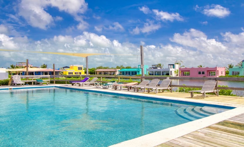 Enjoy Caribbean Sea views from this one-bedroom condo at Mara Laguna in San Pedro. Designed for two, it features a king bedroom, full kitchen, private balcony, and access to the community outdoor pool, with the lagoon nearby and the beach a short walk away.