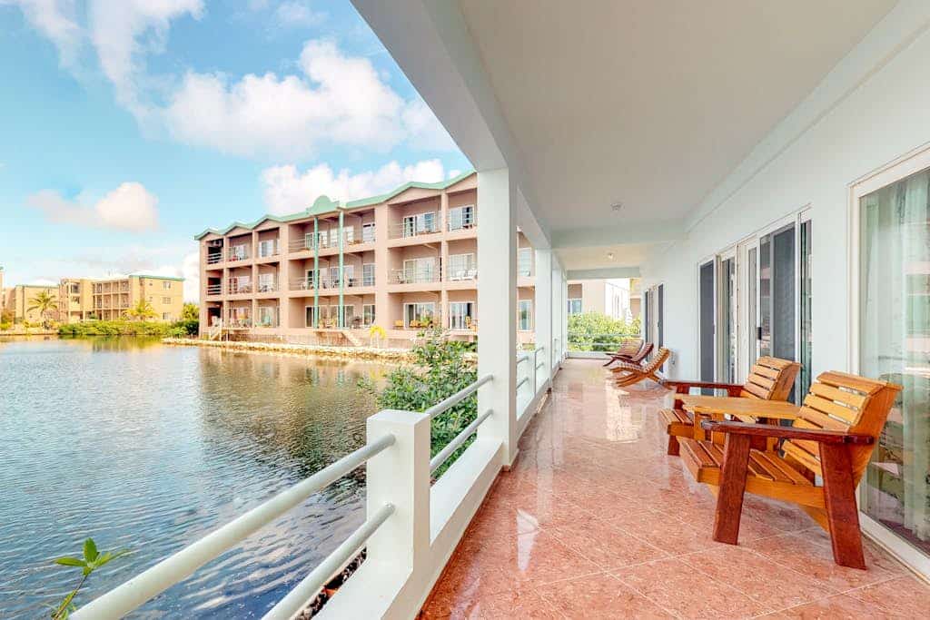 Beautiful lake-view villa with balcony, pool, & partial AC - near dining & shops