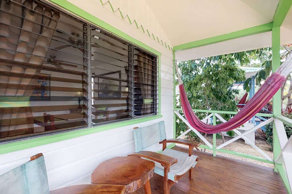 Wood cabana with a porch, pool view, WiFi, and a shared common area with grills