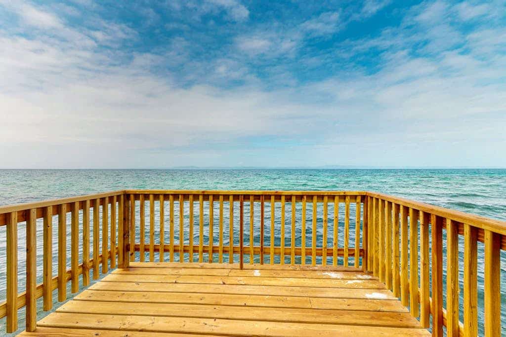 Rustic oceanfront cabin w/overwater kitchenette, sea views & private deck
