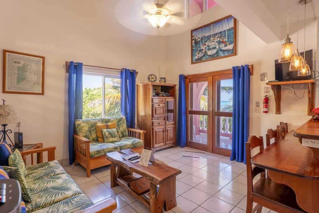 Breezy 2-story oceanfront condo with pool, sea views & partial AC