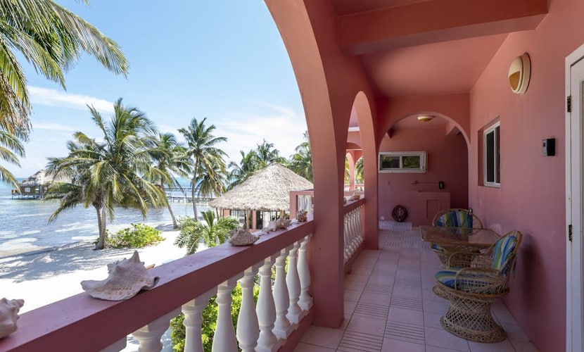 Breezy 2-story oceanfront condo with pool, sea views & partial AC