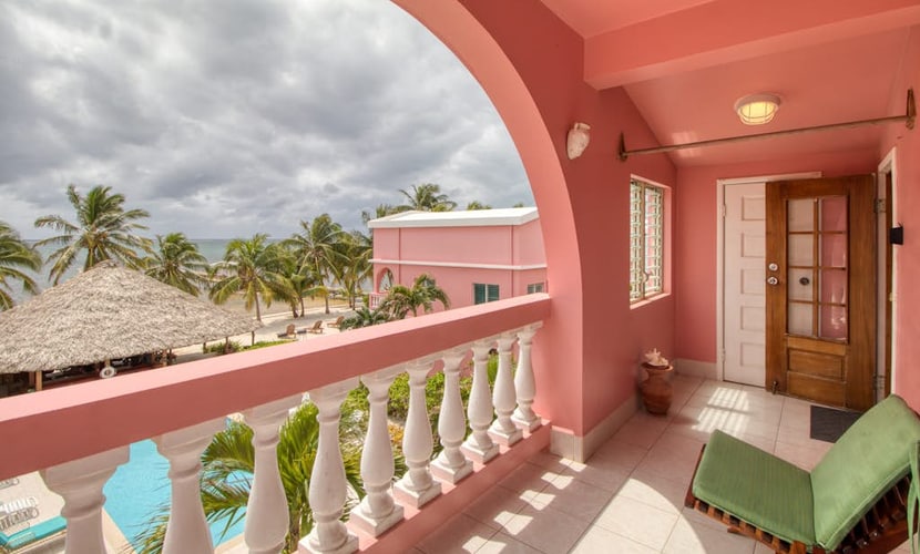 Ocean-view 3rd-floor condo with outdoor pool, dock, grill, balcony, beach access